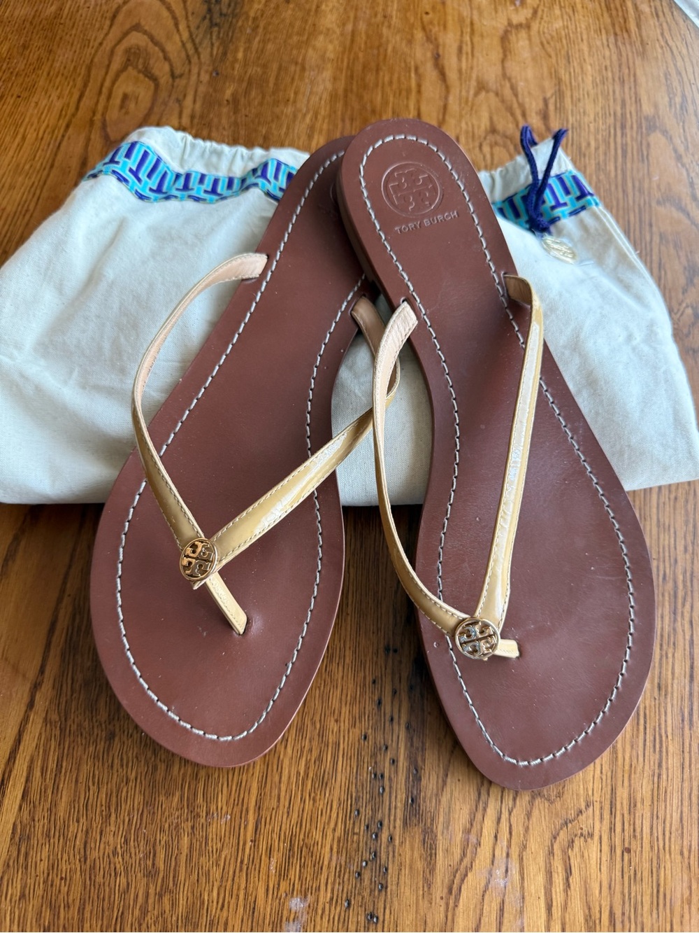 Tory Burch Terra Brown Leather Flip Sandals with cream colored Straps